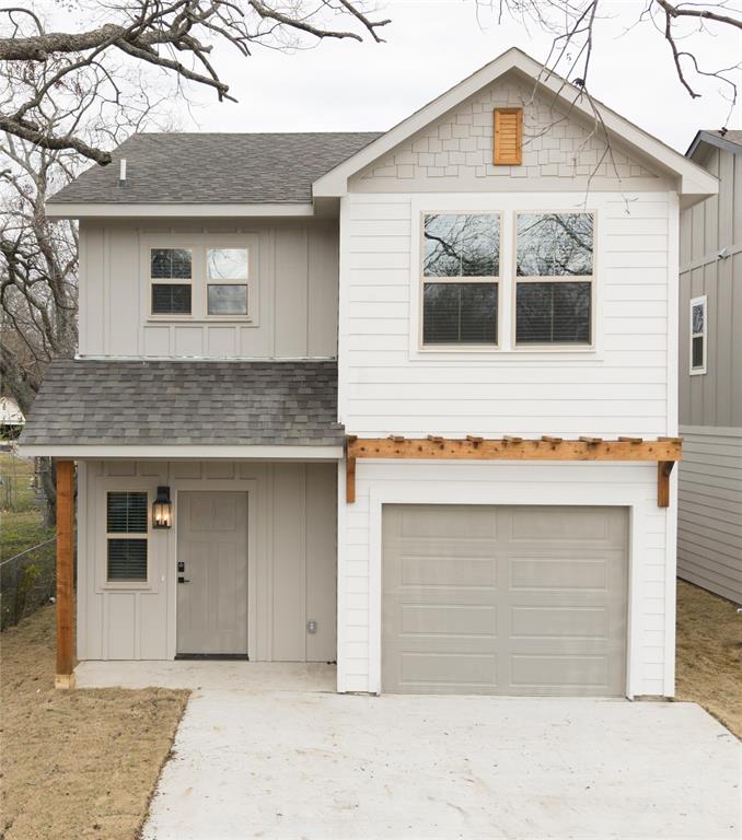 a front view of a house with garage