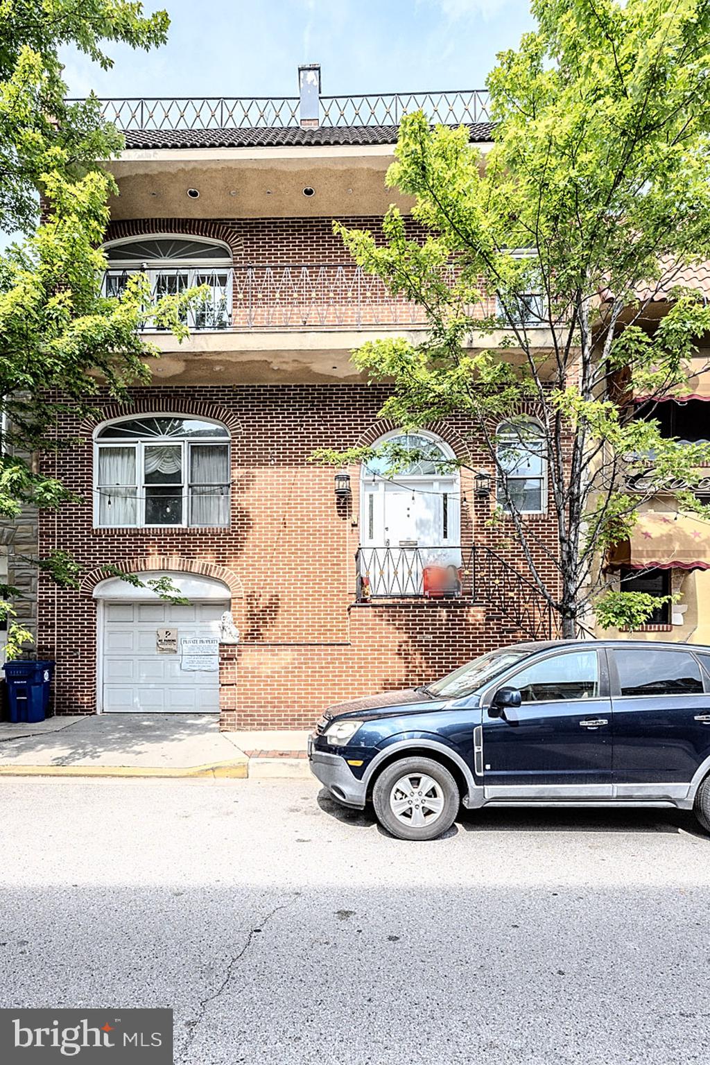 a car parked in front of a house