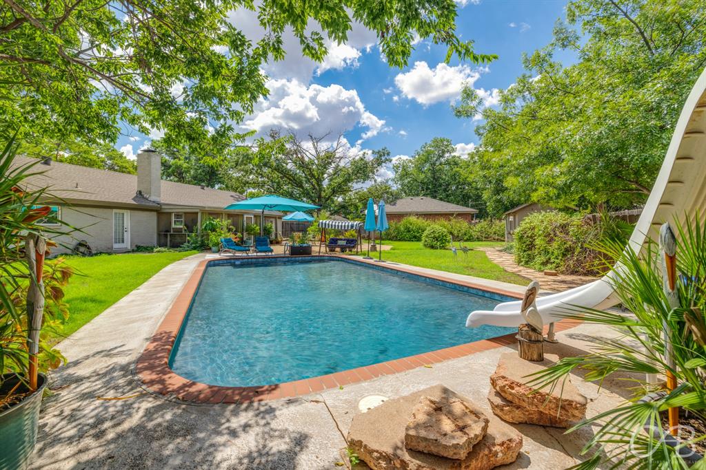 a view of a backyard with a patio