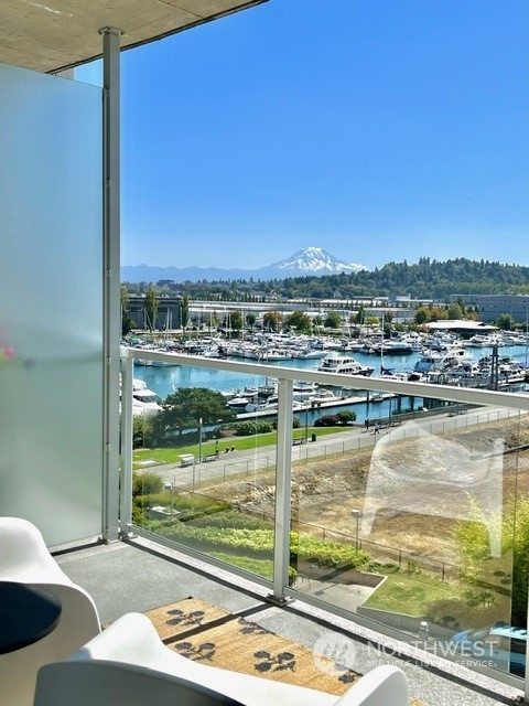 a view of a lake from a balcony with an outdoor space