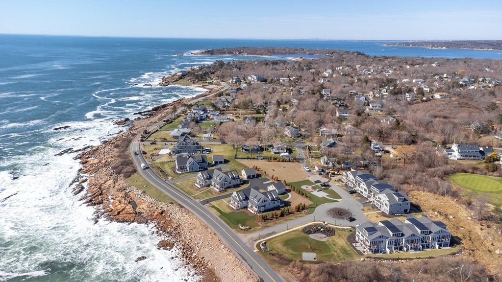 an aerial view of a house with a ocean view