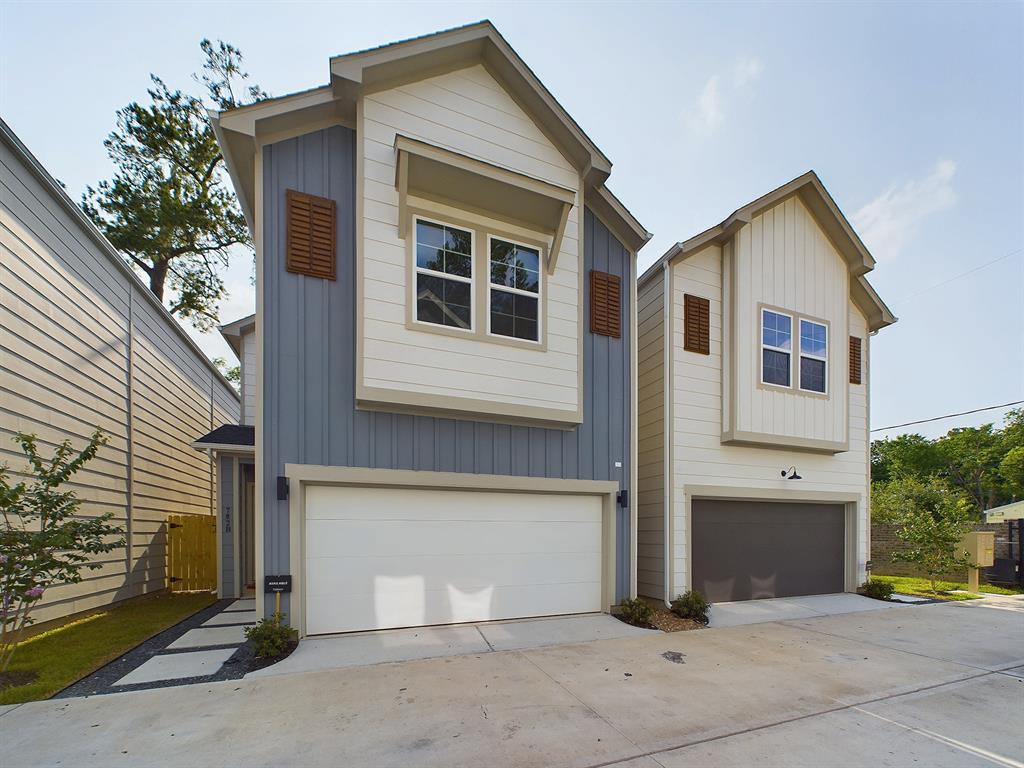 a front view of a house with garage