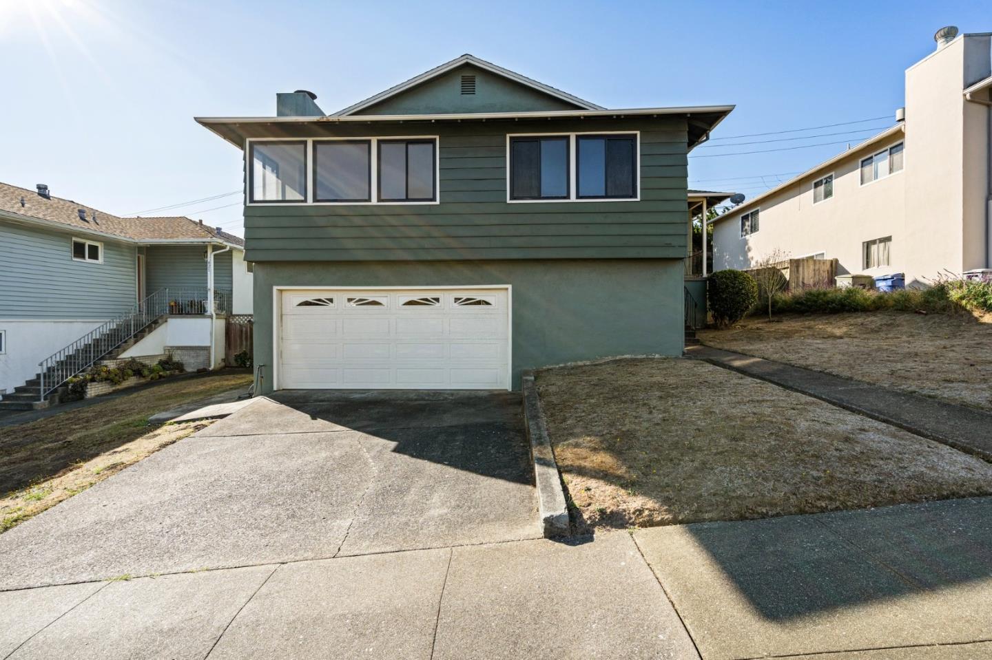 a front view of a house with parking