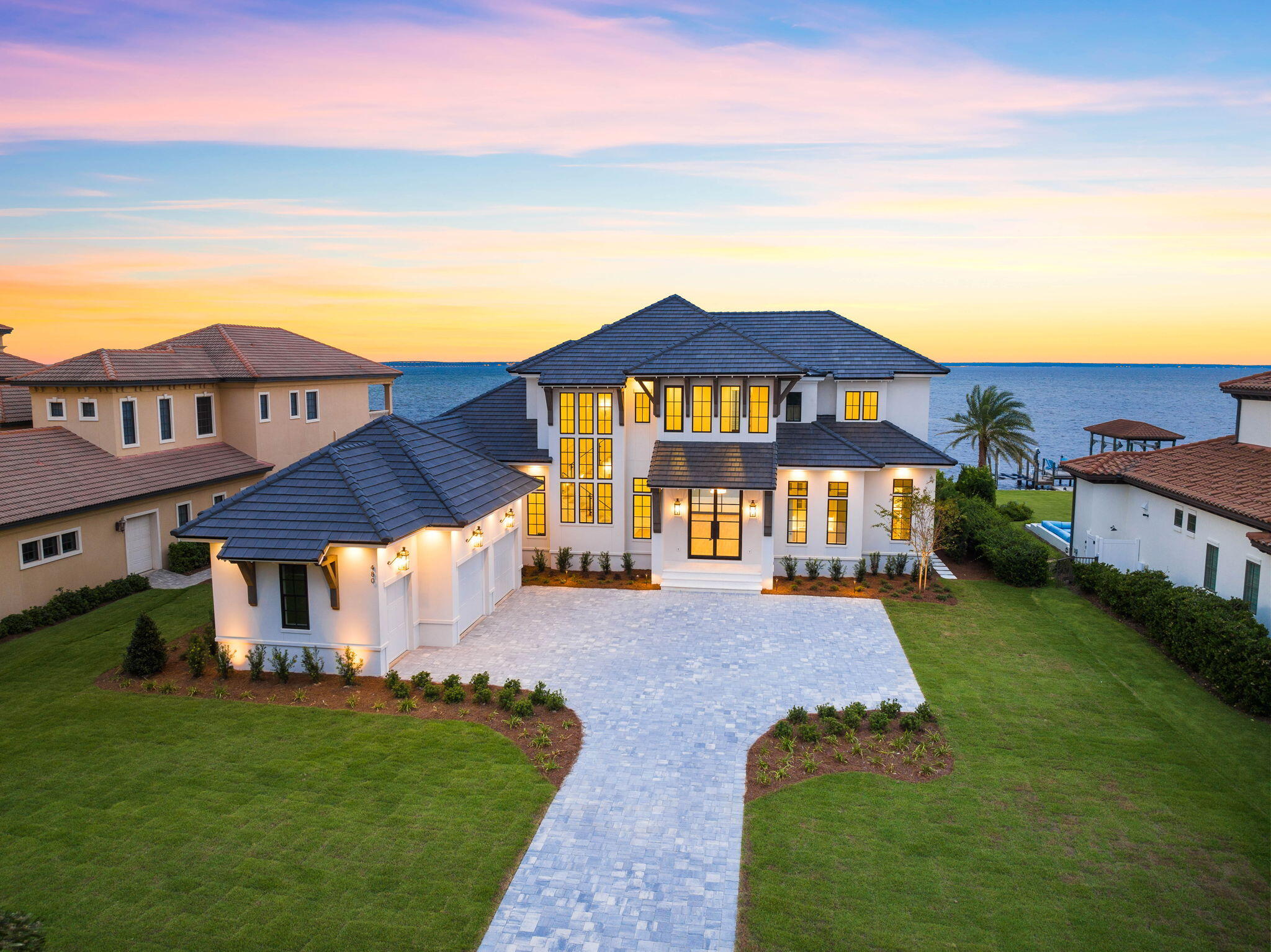 a front view of a house with a yard