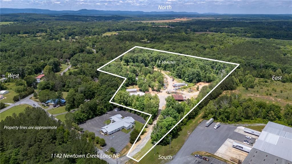 an aerial view of house with yard