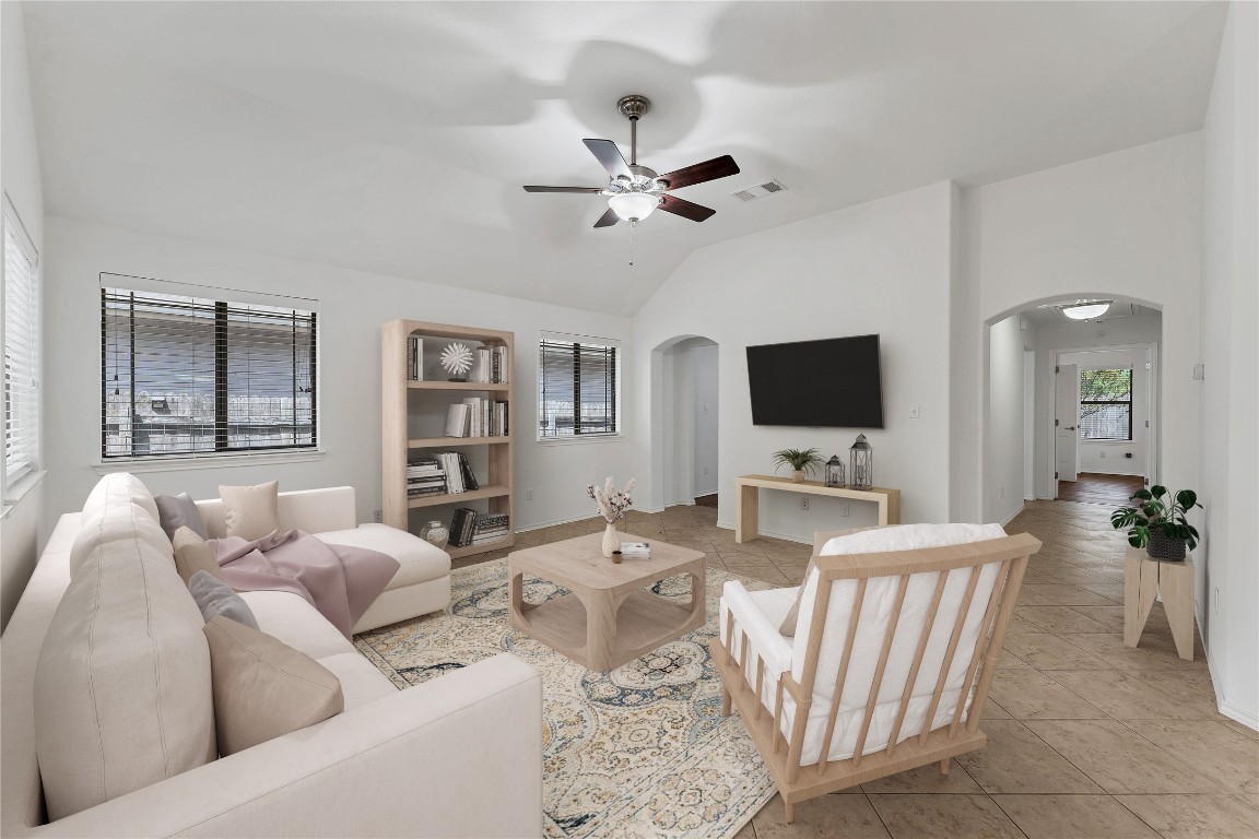 a living room with furniture and a flat screen tv