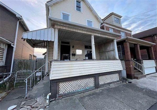 front view of a house with a balcony