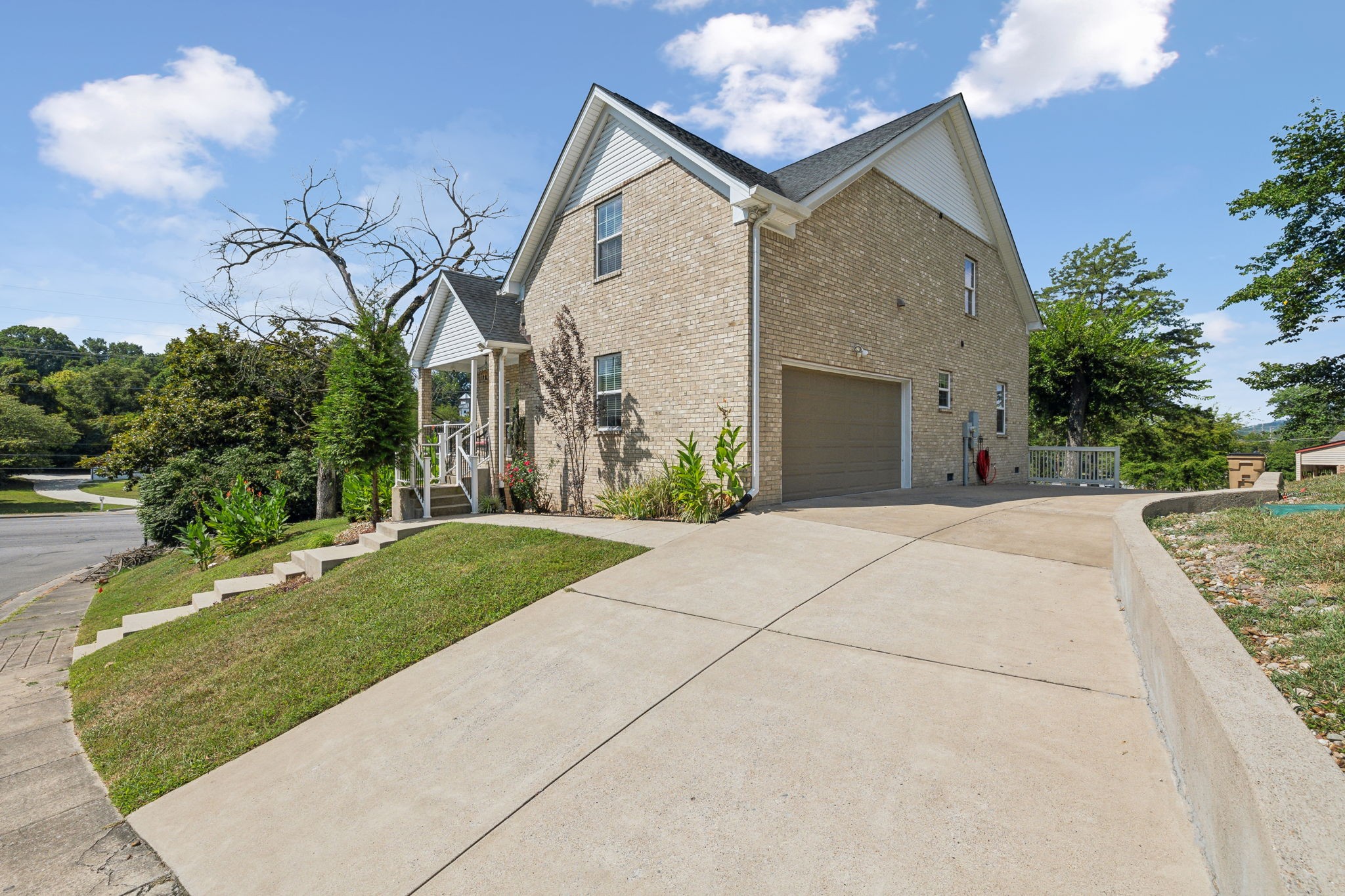 a front view of a house with garden