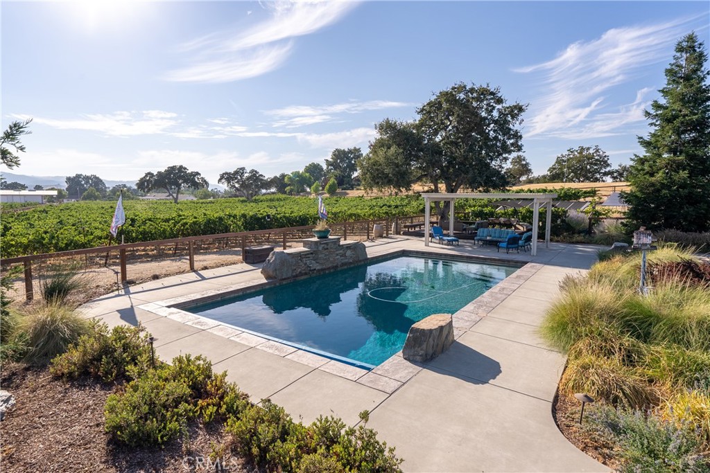 a view of a swimming pool with a patio