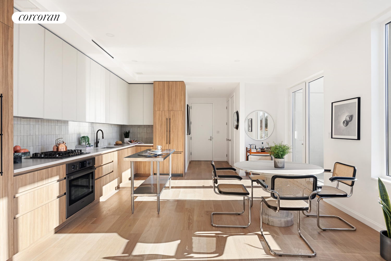 a living room with stainless steel appliances kitchen island granite countertop furniture and a view of kitchen