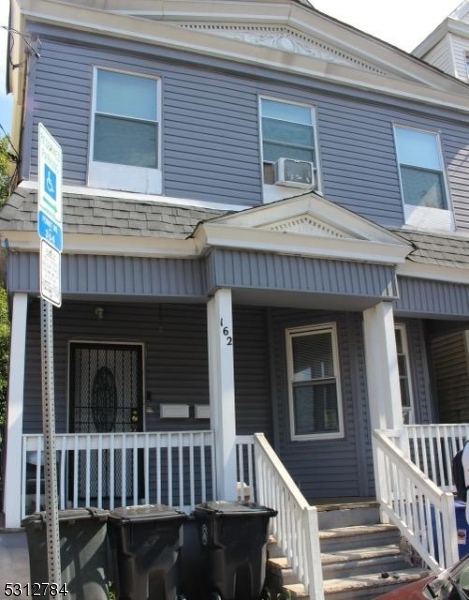 a front view of a house with a porch