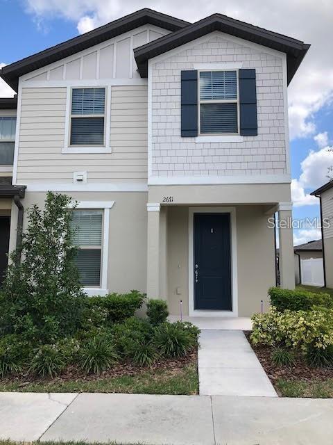 a front view of a house with garage