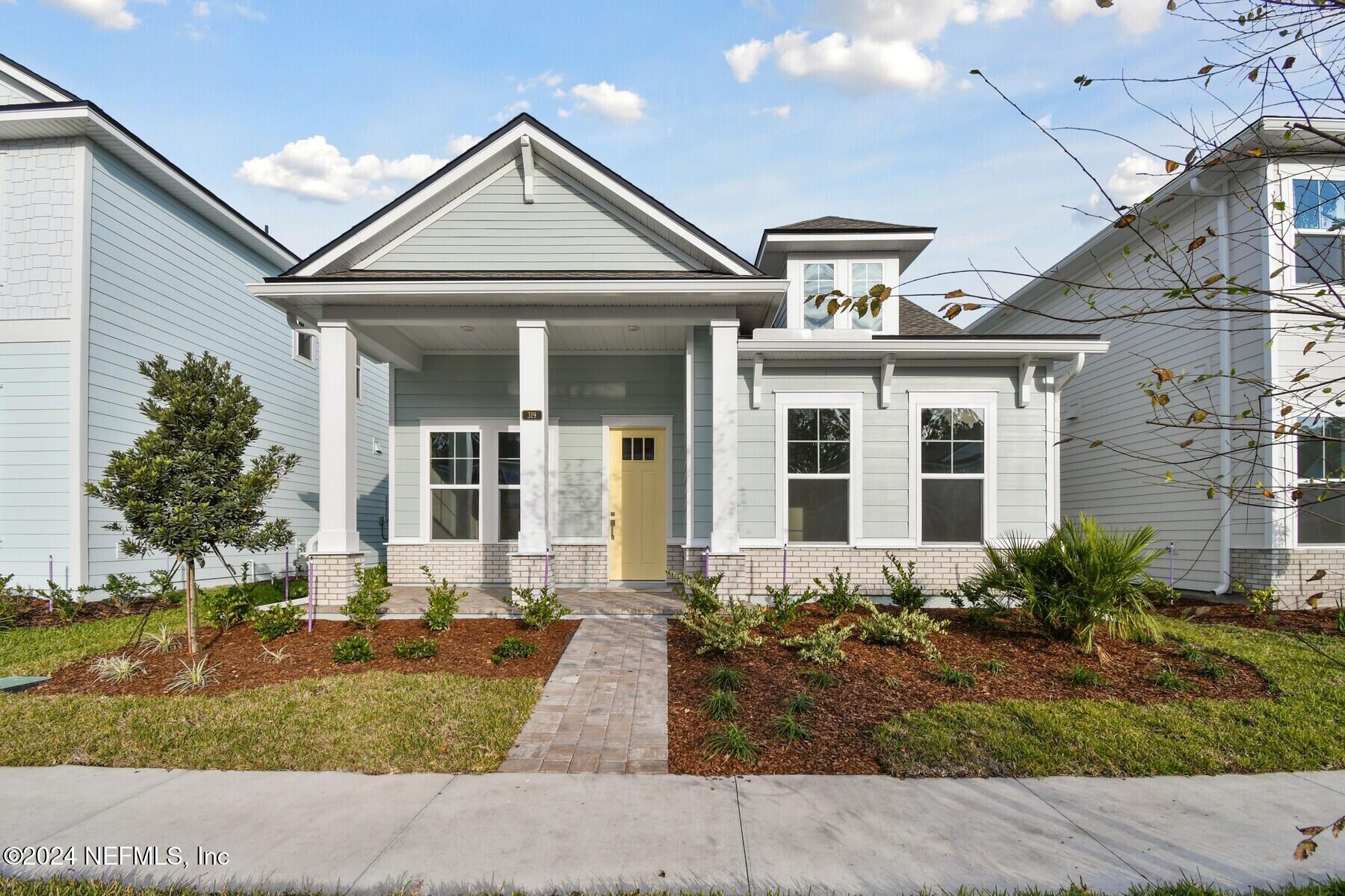 a front view of a house with garden