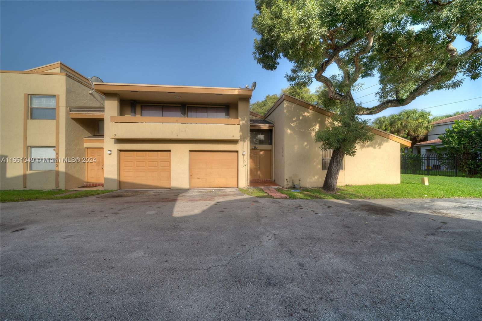 a view of a house with a yard and garage