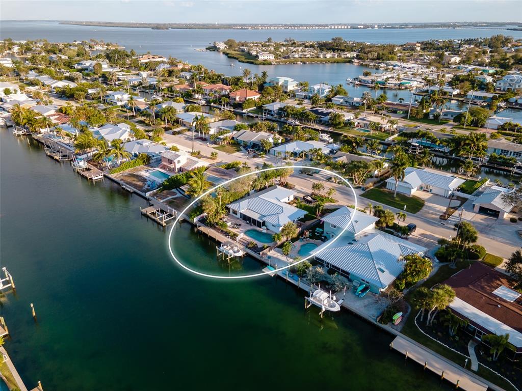 an aerial view of a house with a lake view