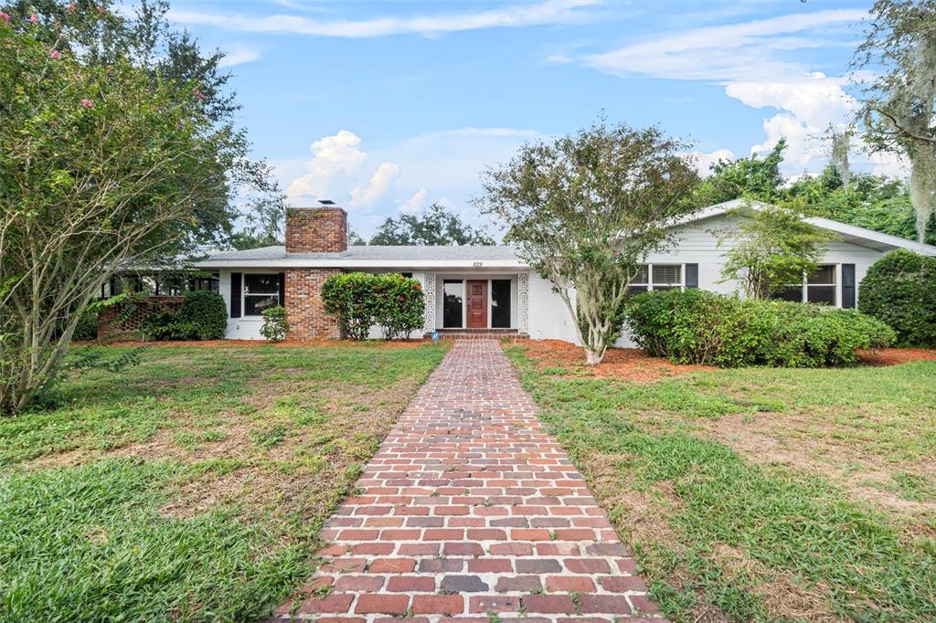 front view of a house with a yard