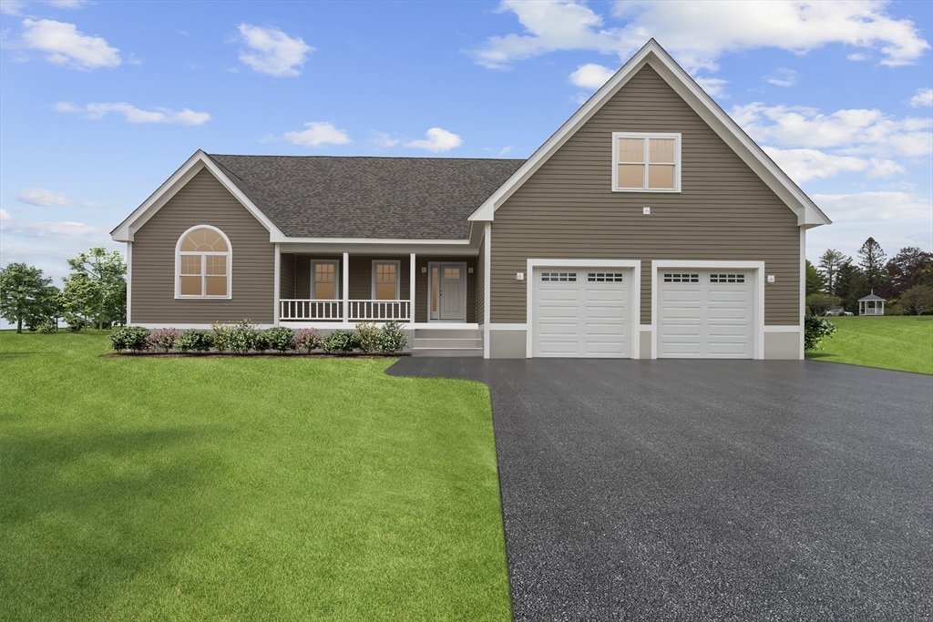 a front view of house with a garden