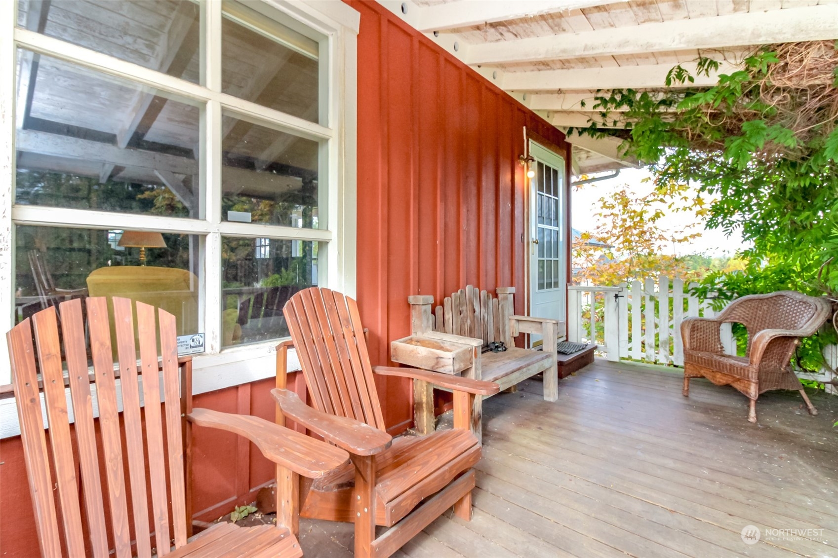 a balcony with furniture and a potted plant