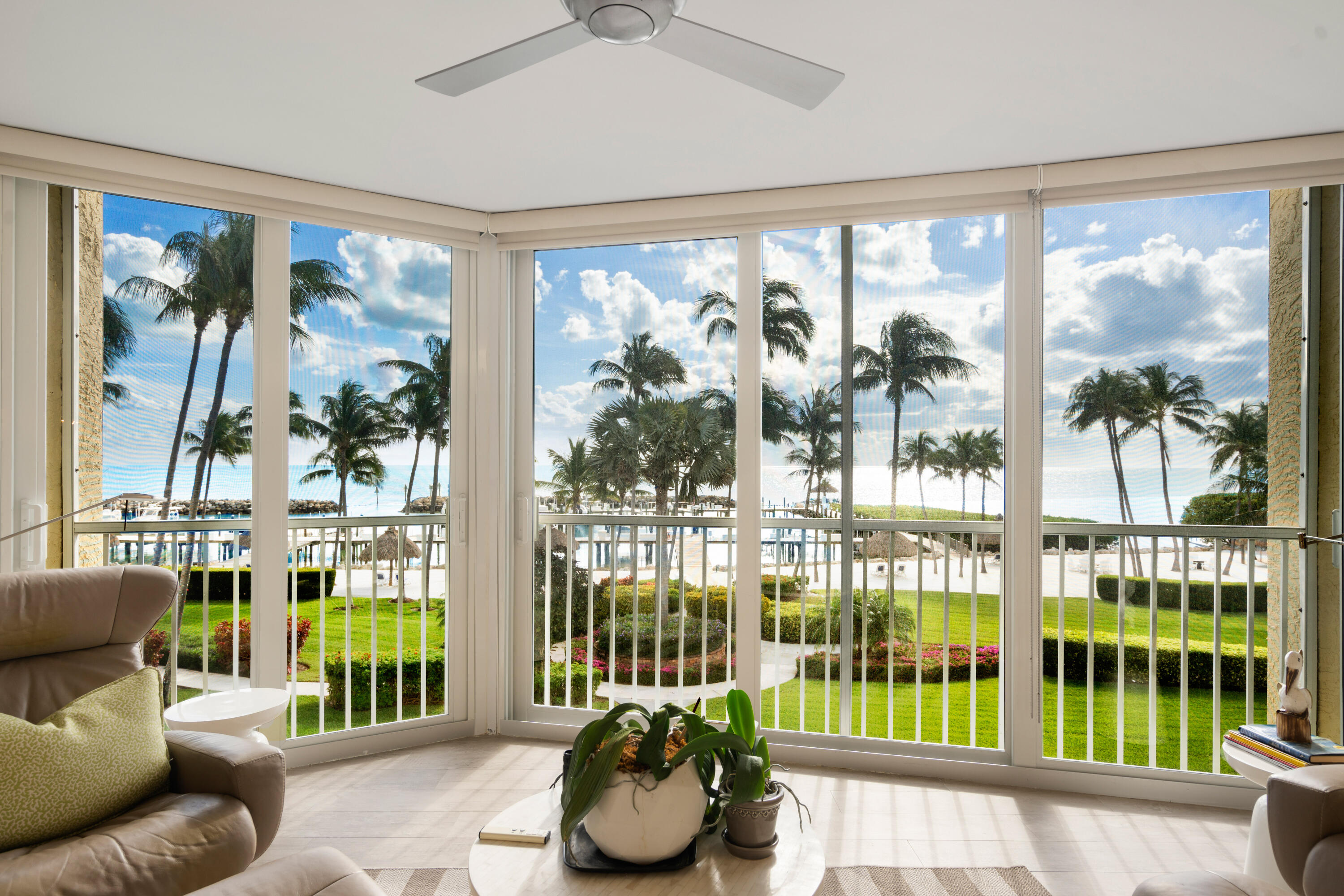 a living room filled with furniture and garden view