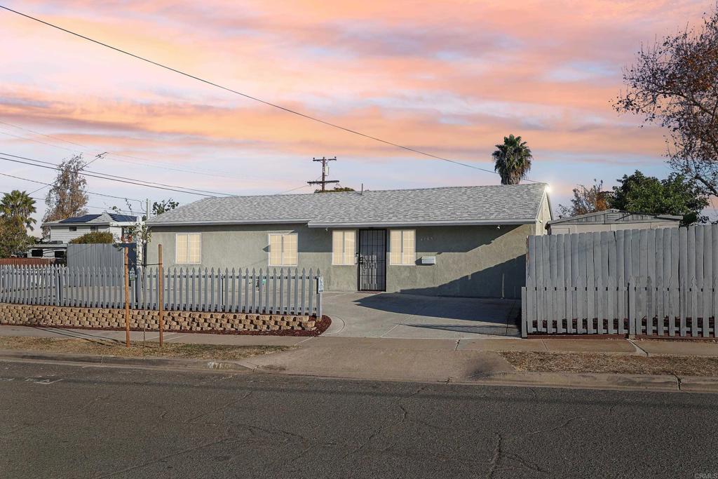 a view of a house with a street