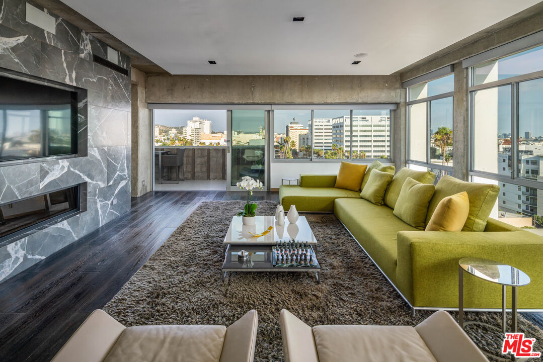 a living room with furniture and a large window