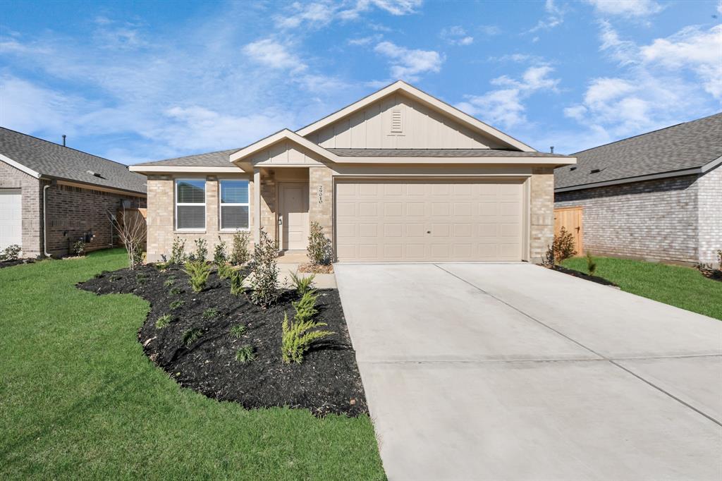 The exterior features clean lines, fresh landscaping, and a welcoming entrance.