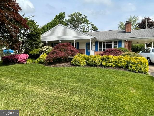 a front view of house with yard and green space