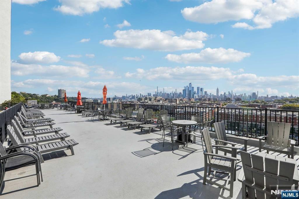 a view of roof deck with patio