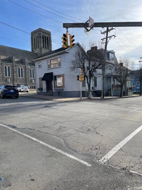 a front view of a building with streets