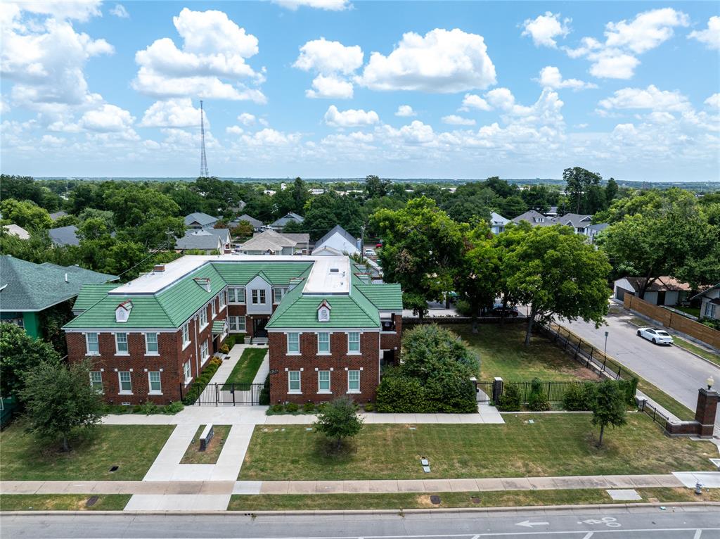 a aerial view of multiple houses with yard