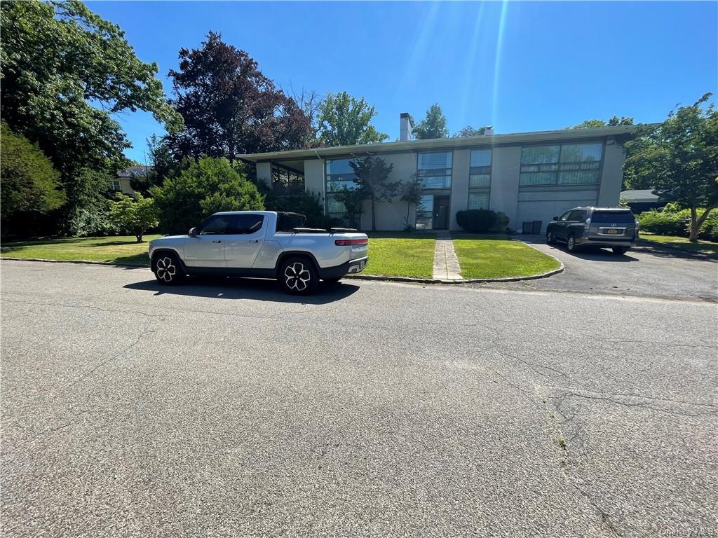 a view of a car is parked in front of a house