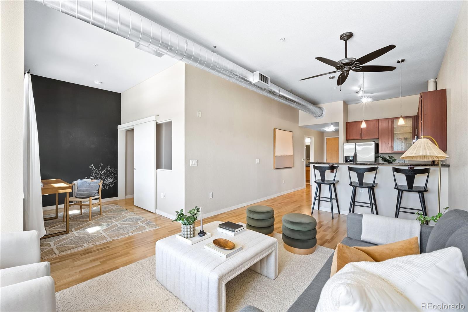 a living room with lots of furniture and white walls