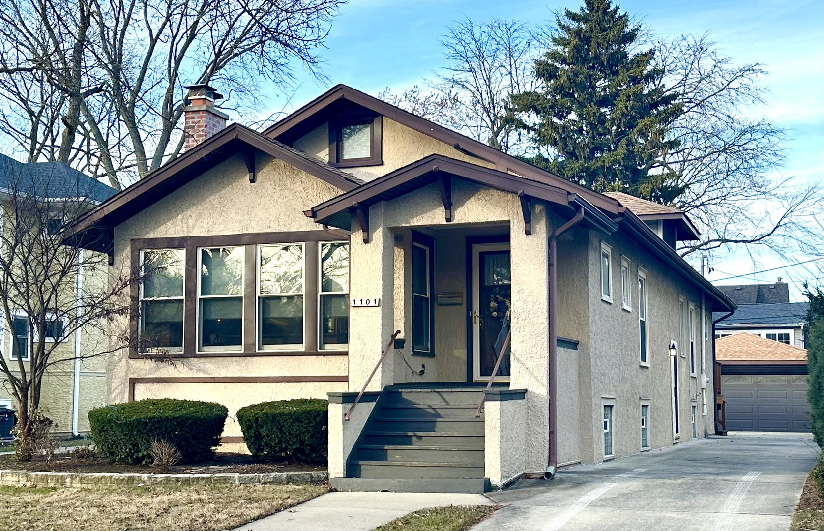 a front view of a house with garage