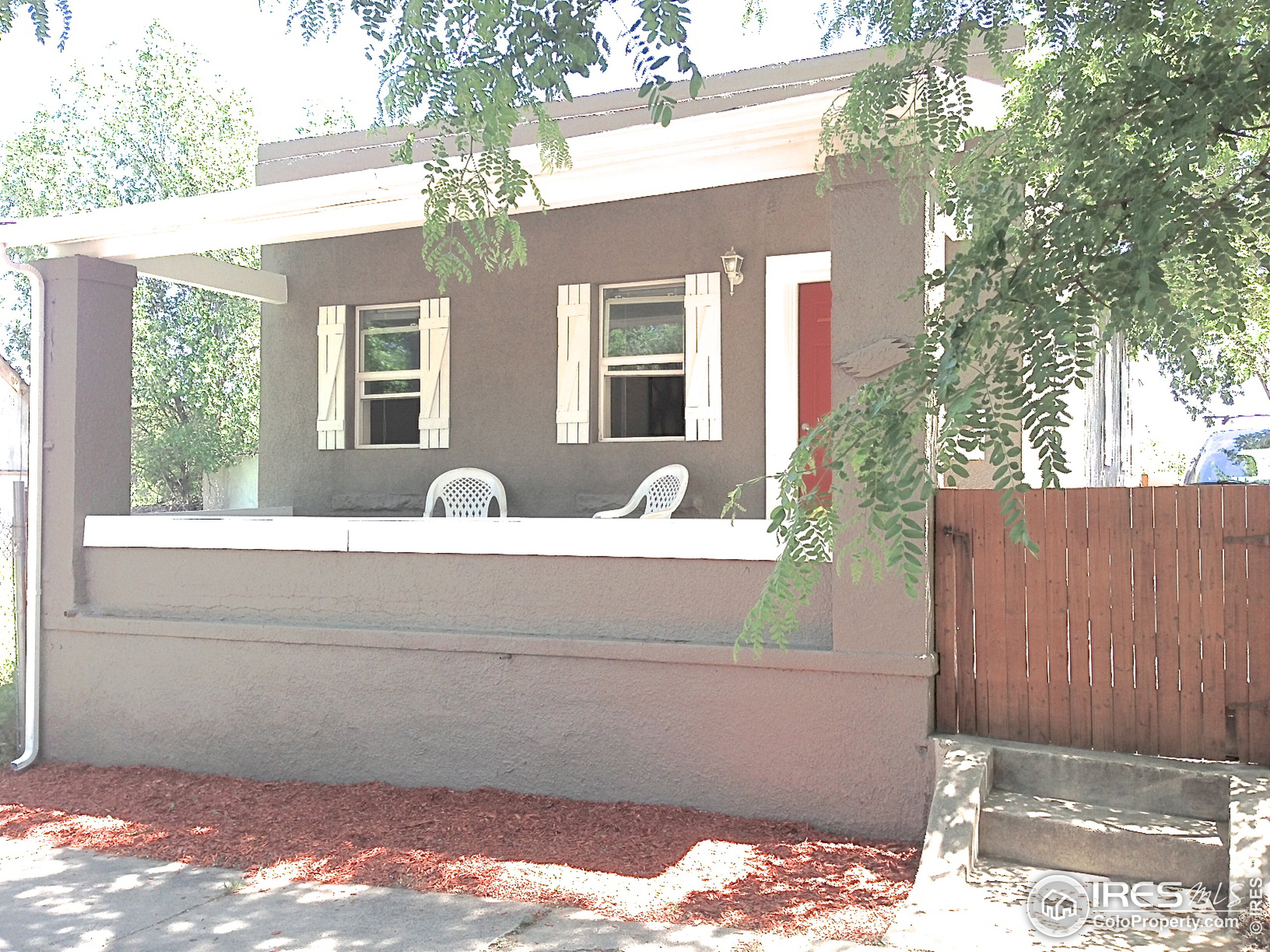 a front view of a house with parking