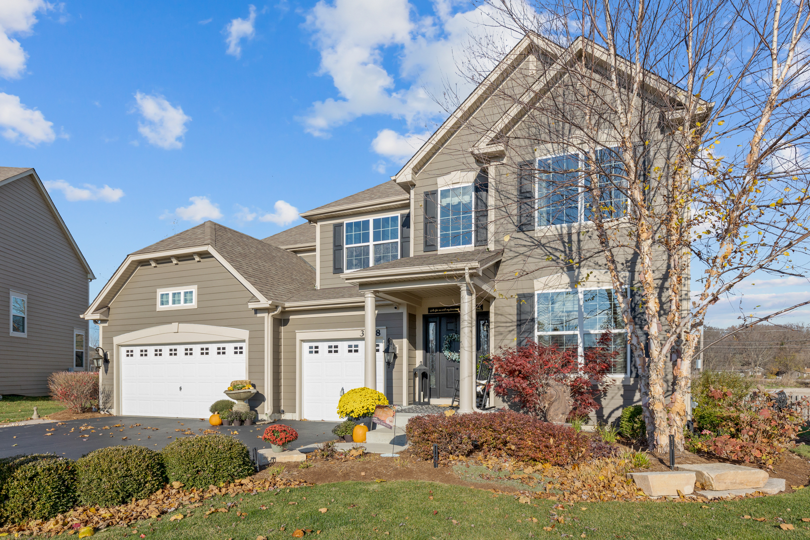 a front view of a house with a yard