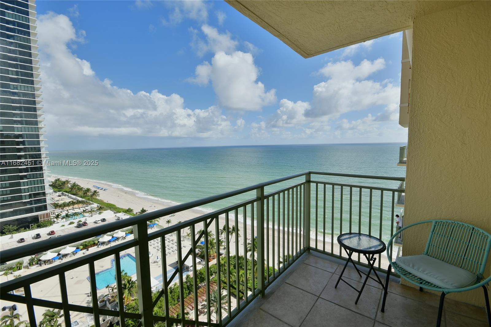 a view of a balcony with chairs