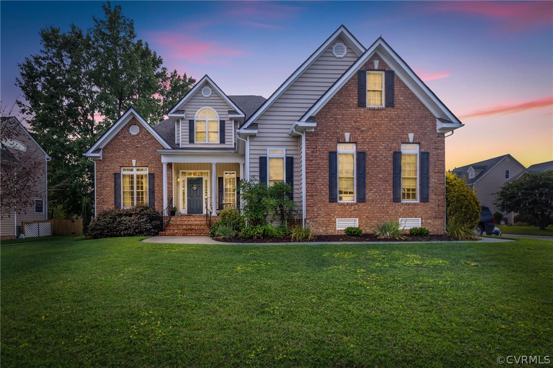 a front view of a house with a yard