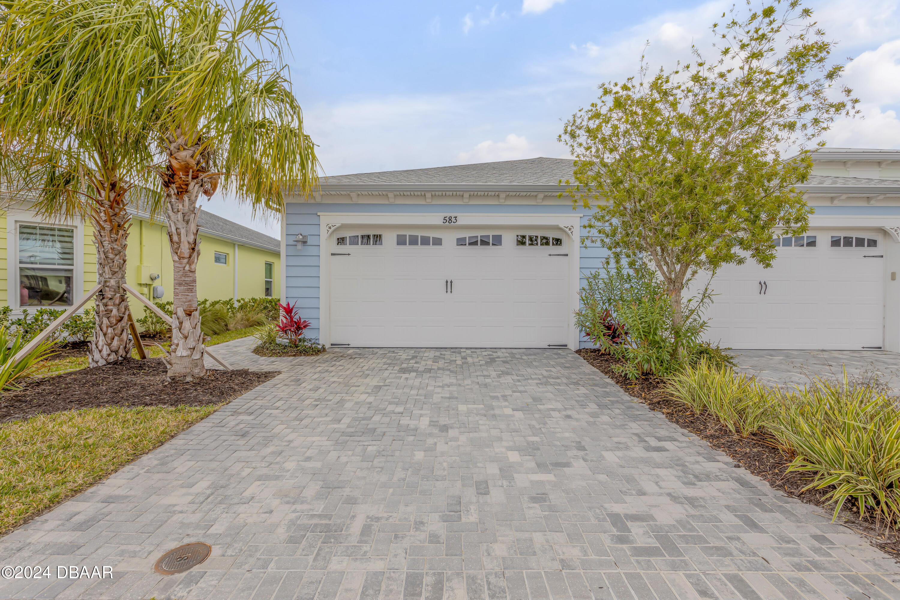 a view of garage and a yard