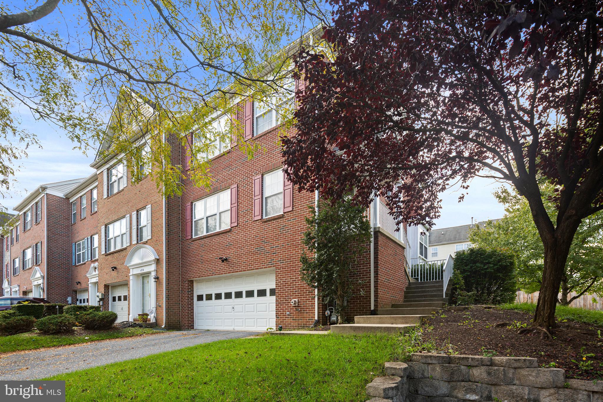 a view of a building with a yard