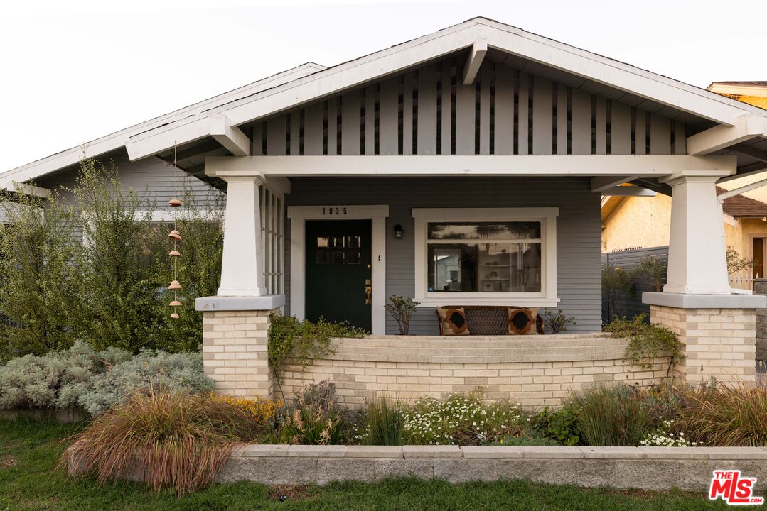 a view of house with yard