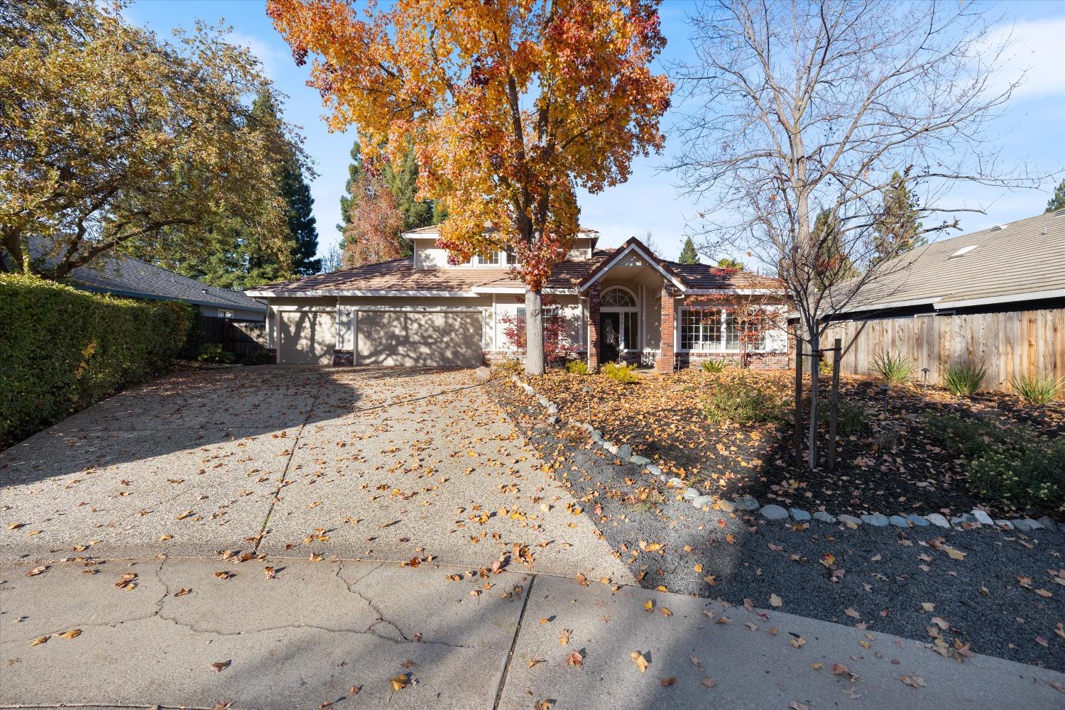 a view of a house with a yard covered with snow in the background