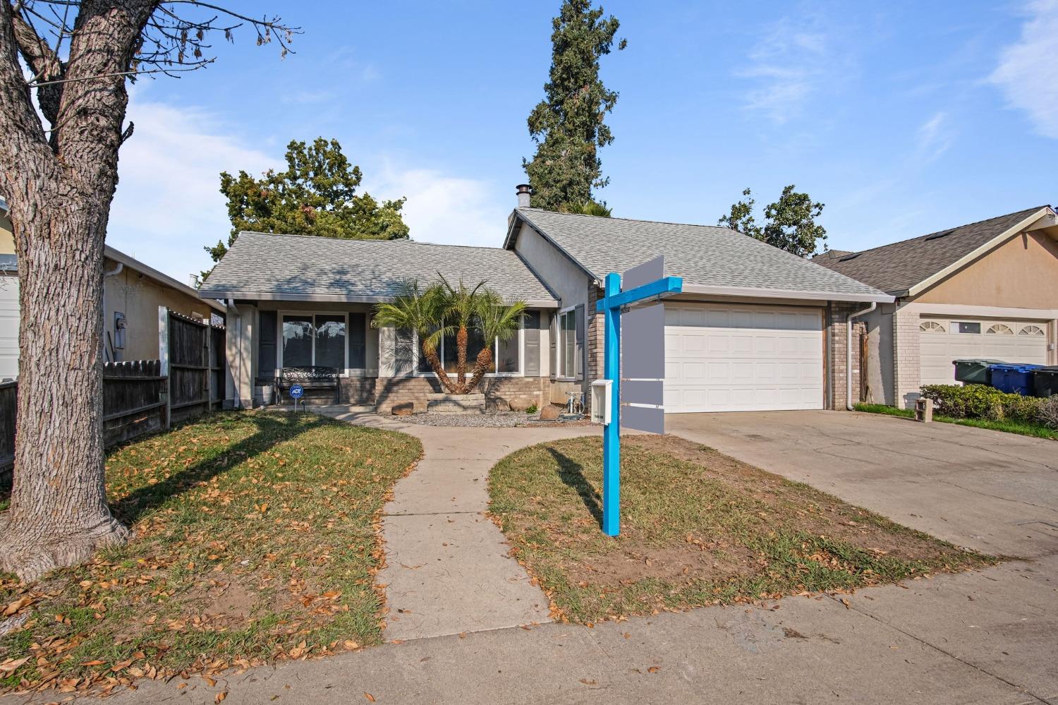 a view of a house with swimming pool and a yard