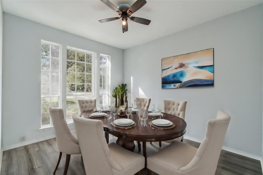 a view of a dining room with furniture window and wooden floor