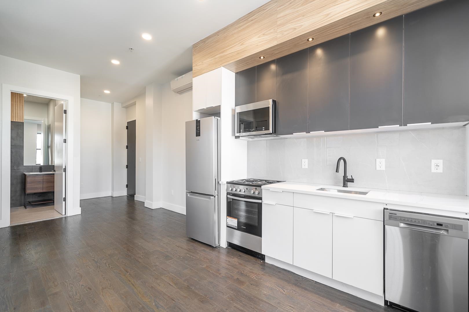 a kitchen with a sink stainless steel appliances and cabinets