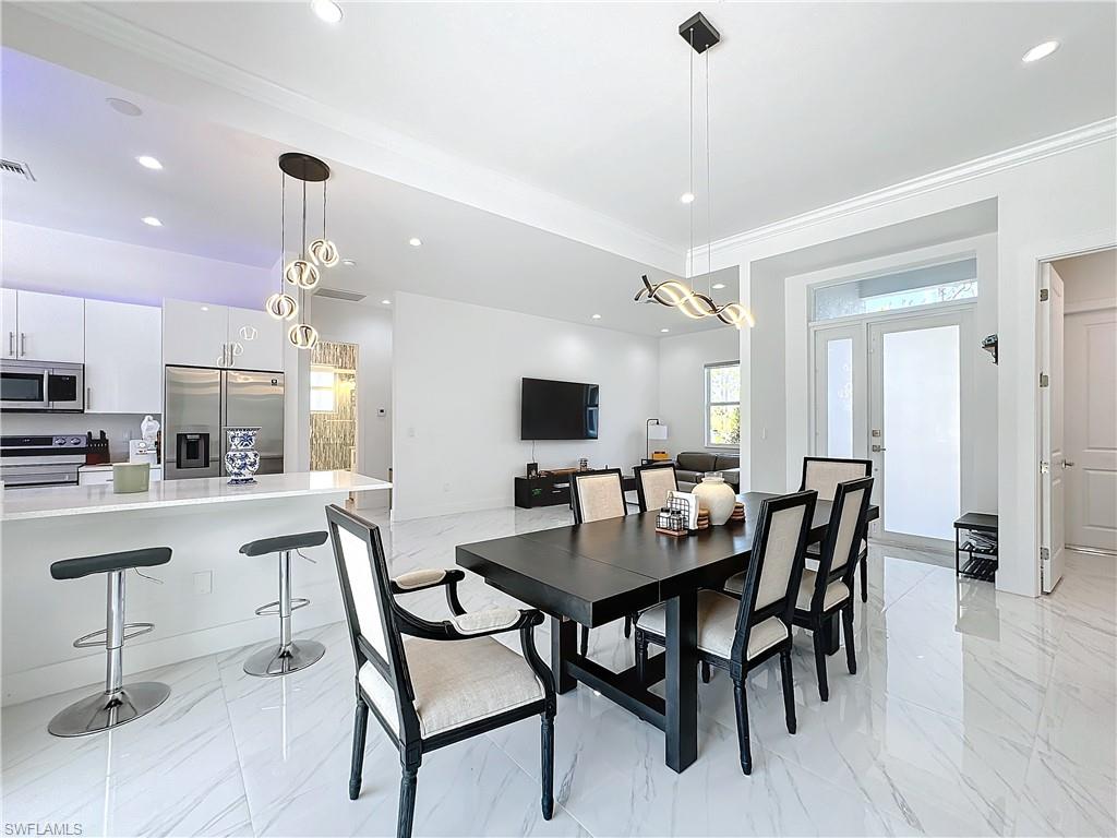 a view of a dining room with furniture