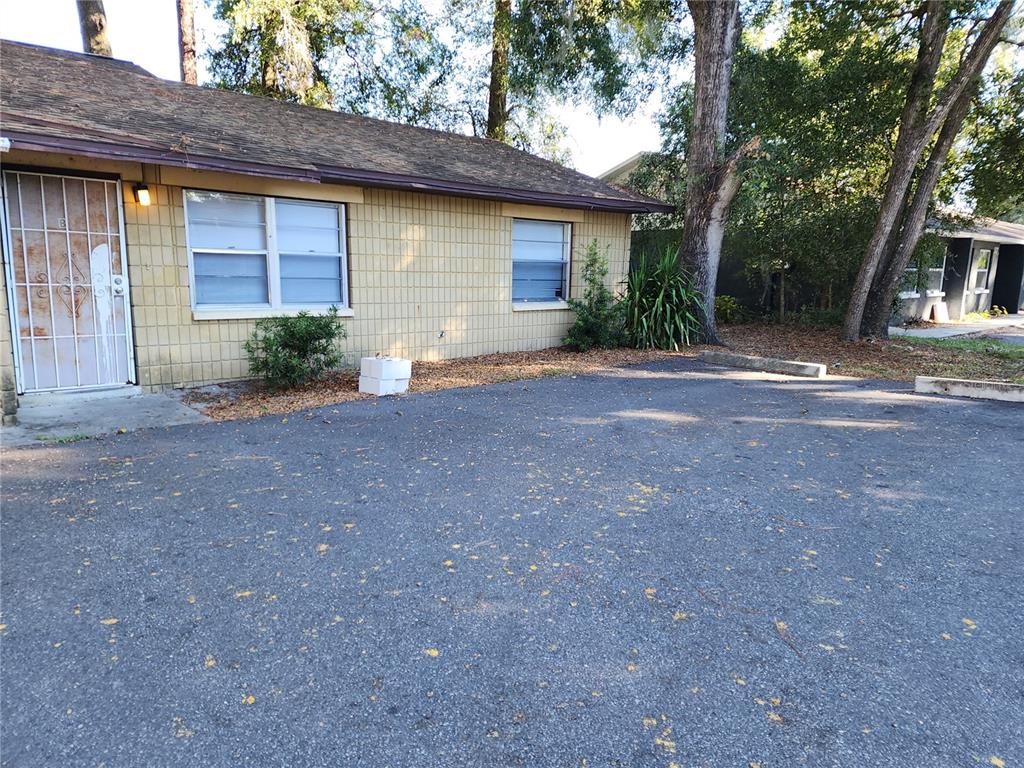 a view of a house with a yard and garage