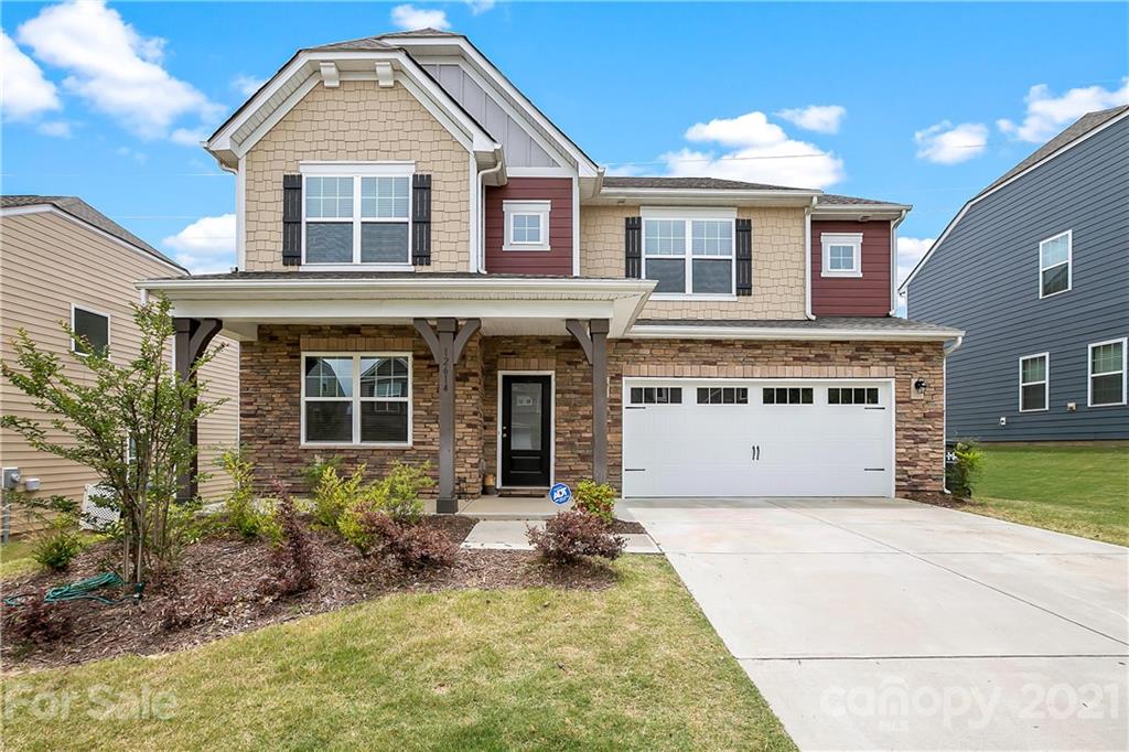 front view of a house with a yard