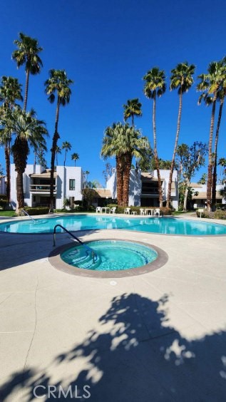 a view of a house with a yard and a fountain