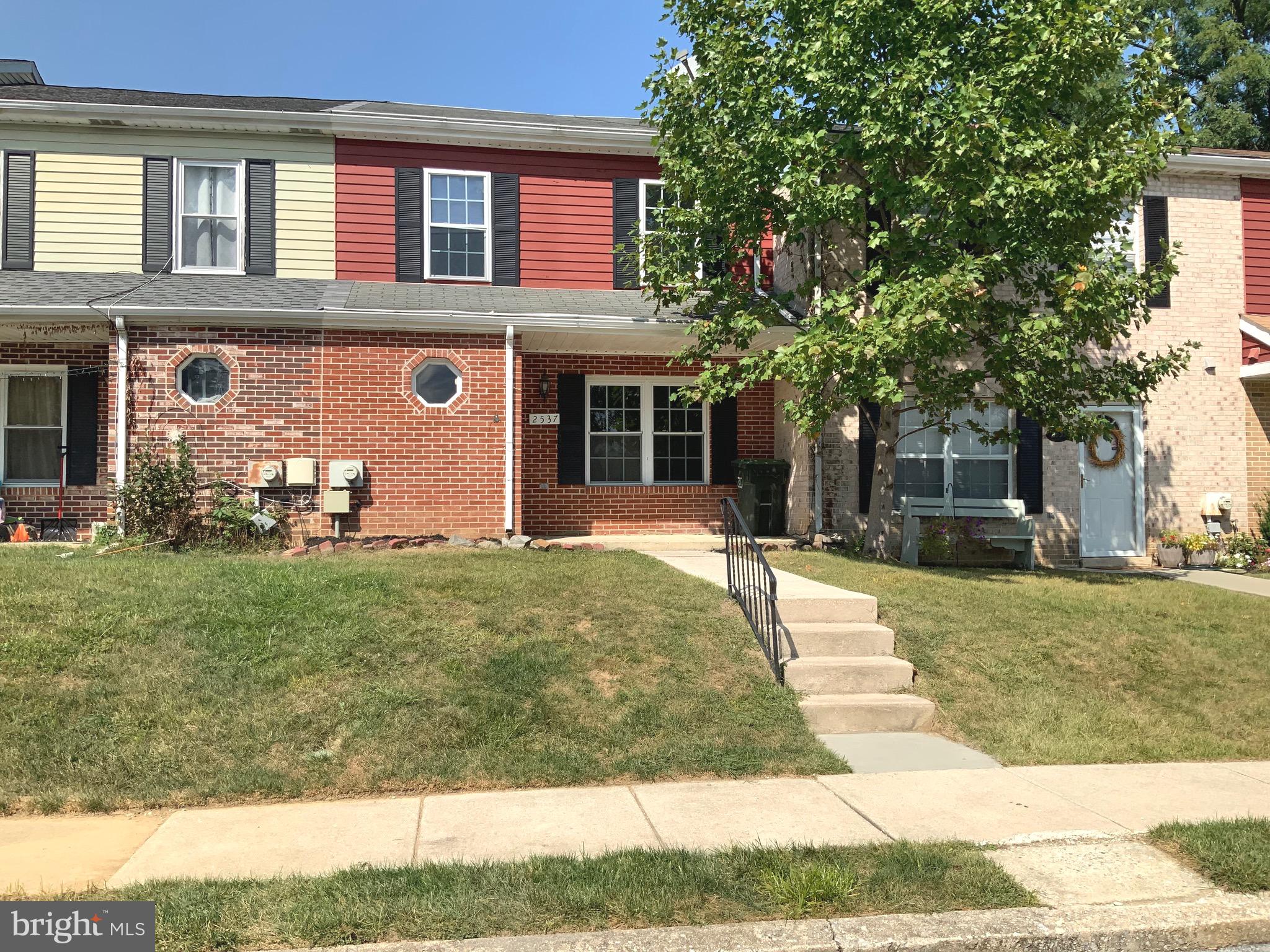 front view of a house with a yard