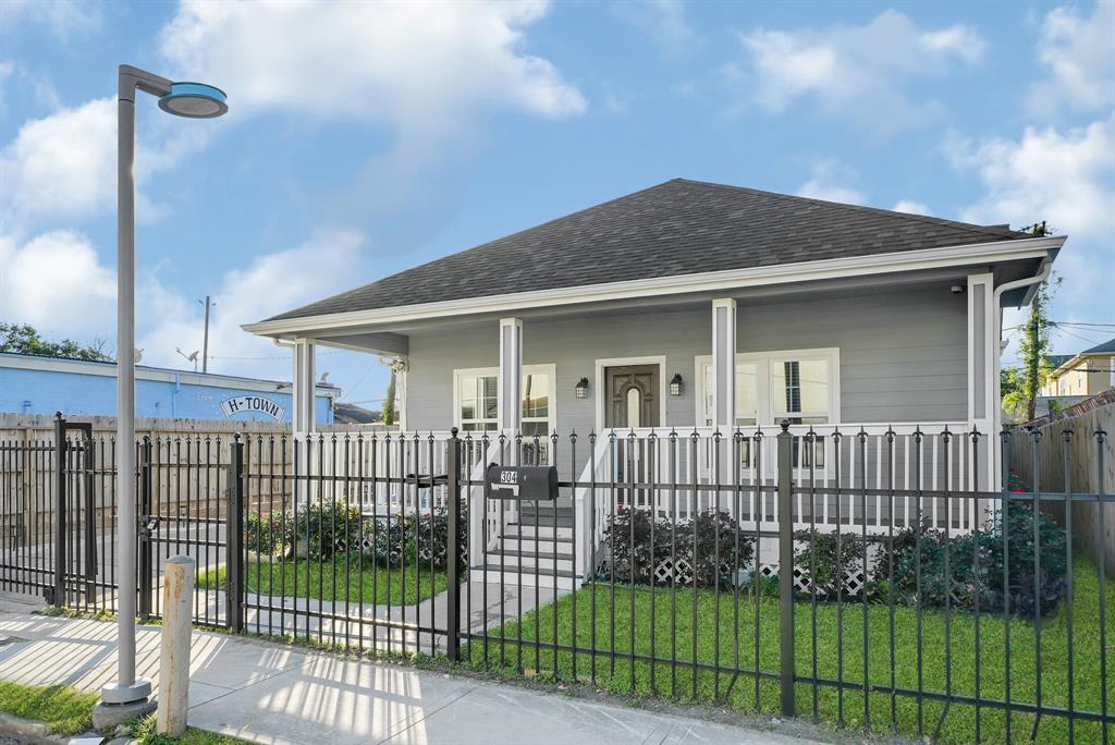 a view of a house with a fence